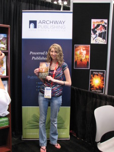 Jessica Stafford shows off her book at the Archway Publishing reception at BEA 2015.